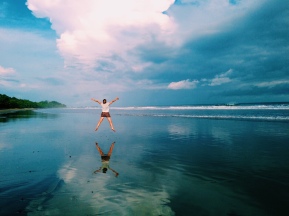 Jumping for joy on the beach in Montezuma